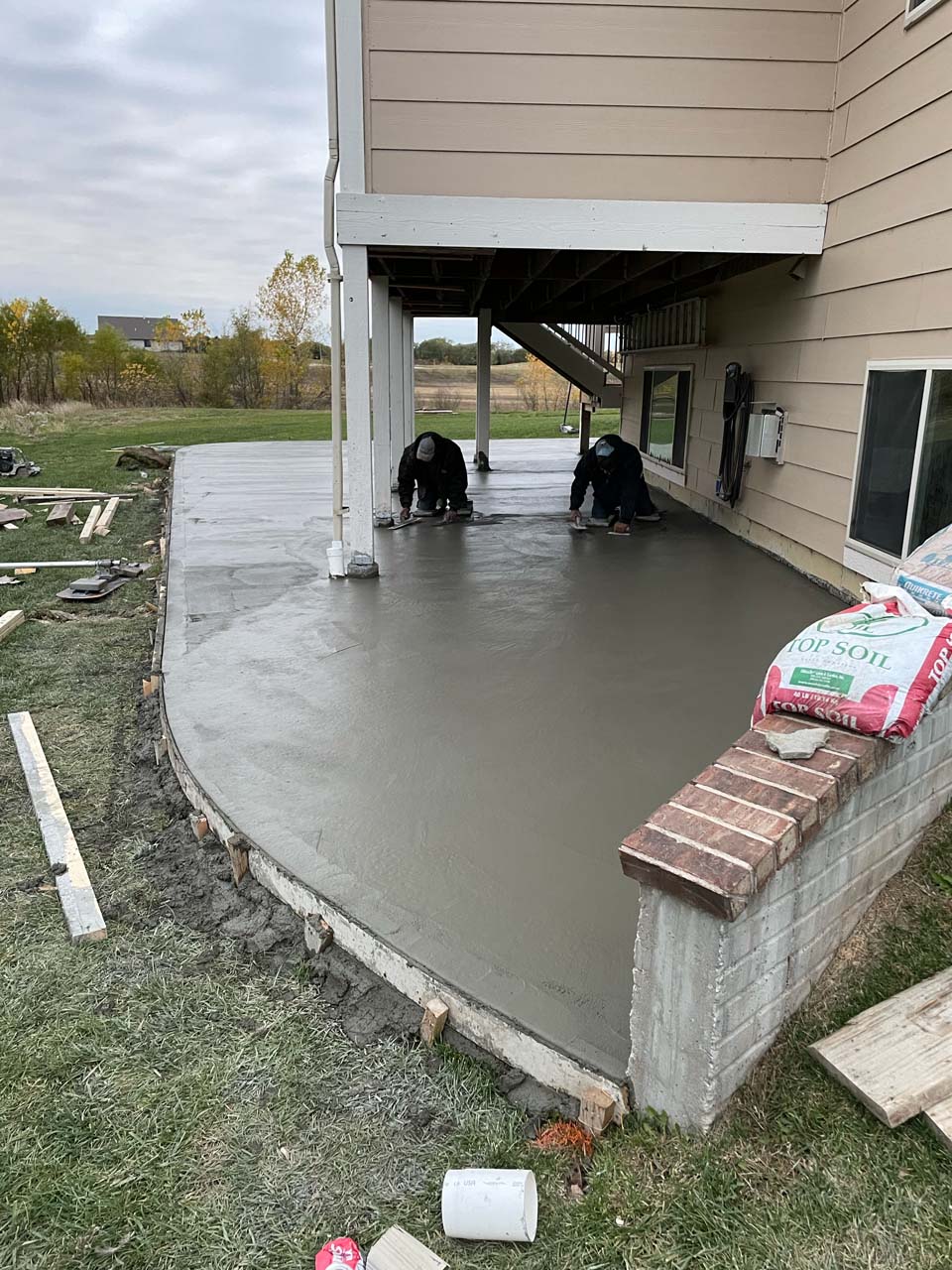New Image Roofing & Construction smoothing wet concrete