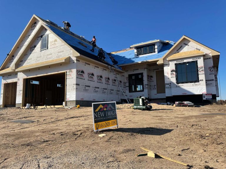 New Image Roofing workers install a roof on a new home build