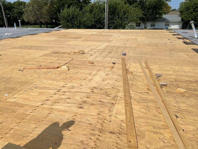 Preparing a commercial roof with underlayment